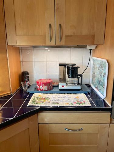 a kitchen with a counter top with a coffee maker at The Soldiers house in Ekshard
