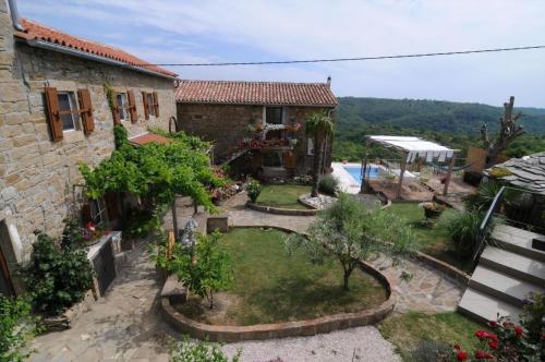 a house with a garden and a swimming pool at Villa Casa Sarina in Brdo