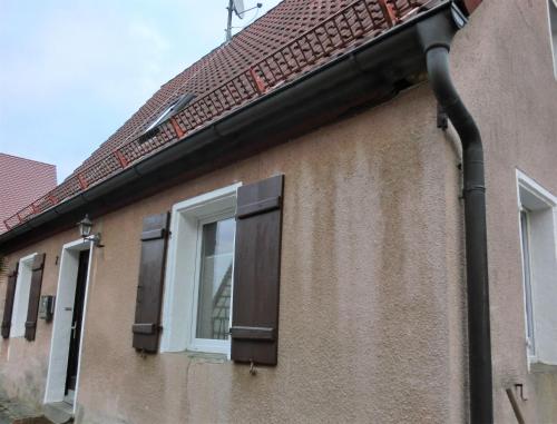 a black pipe on the side of a building at Ferienwohnung Lauf in Lauf an der Pegnitz