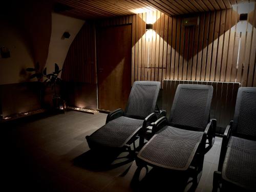 a row of chairs in a waiting room with lights at Resort Nová Včelnice in Nová Včelnice