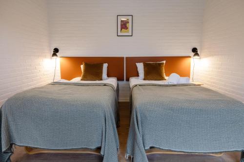 Postel nebo postele na pokoji v ubytování Hotel Lisboa