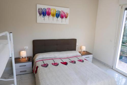 Ένα ή περισσότερα κρεβάτια σε δωμάτιο στο Fiorita 4