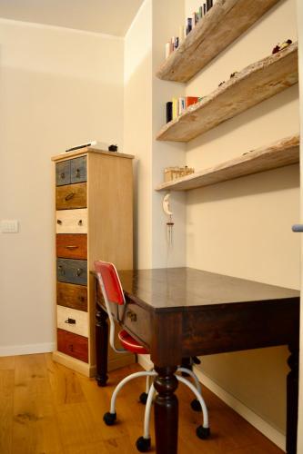 an office with a desk and a red chair at Pane e Marmellata in Signa