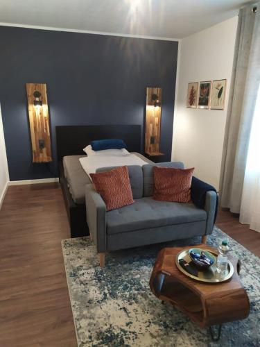 a living room with a couch and a bed at Apartment 17 in Kassel
