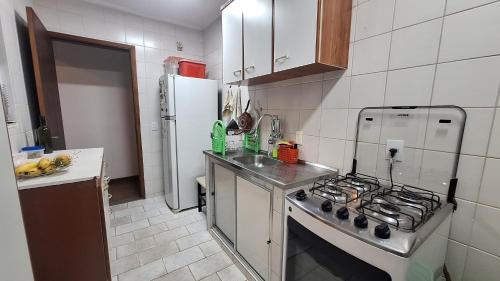 Dapur atau dapur kecil di Quarto aconchegante
