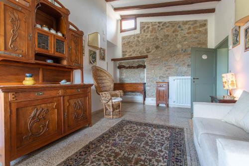 a living room with a couch and a table at Enrica - Agriturismo La Valentina in Talamone