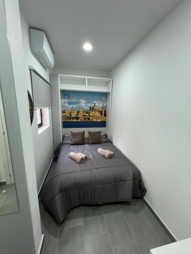 a bedroom with a large bed in a room at Triton Mansion D26 - Entire Unit in St. Paul's Bay