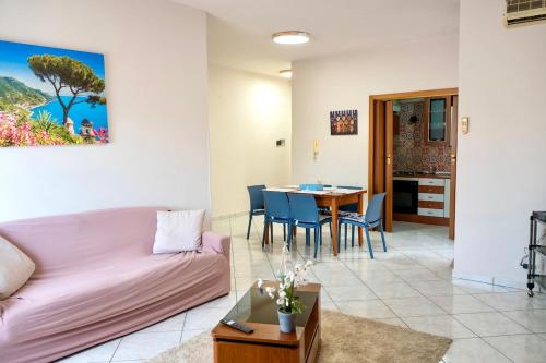 a living room with a couch and a table at La Valle e il Mare - San Leone in San Leone
