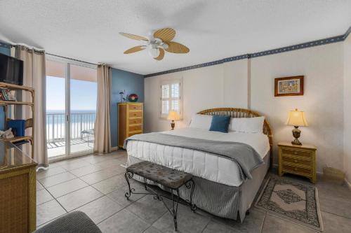 a bedroom with a bed with a view of the ocean at Buena Vista 302 by Vacation Homes Collection in Gulf Shores