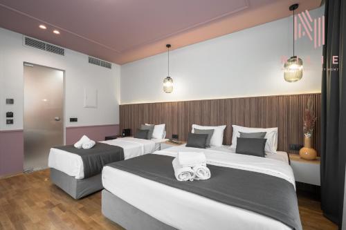 Katil atau katil-katil dalam bilik di Esther Suites, Nilie Hospitality MGMT