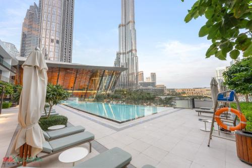 a swimming pool on the roof of a building at SML Vacation Homes - Sky High Apartments with Burj Khalifa and Dubai Fountain Views at Grande Signature, Downtown Dubai in Dubai