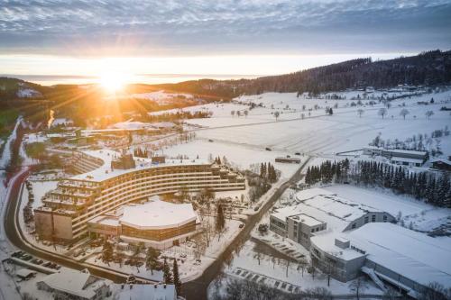 an aerial view of a campus in the snow at Sauerland Stern Hotel in Willingen