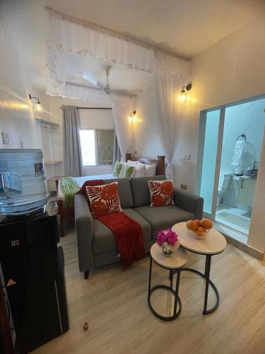 a living room with a couch and a table at Zuri Twin Sands Beach Properties - Malindi in Malindi