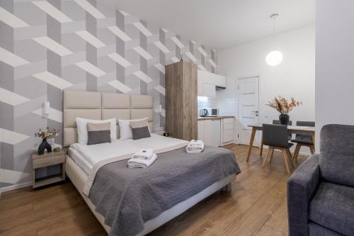 Postel nebo postele na pokoji v ubytování DeMar Apart Chehova