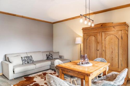 a living room with a couch and a table at Haus Gabriel - Seefeld in Seefeld in Tirol