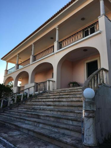 a building with stairs in front of it at Villa Aedan Sintra in Sintra