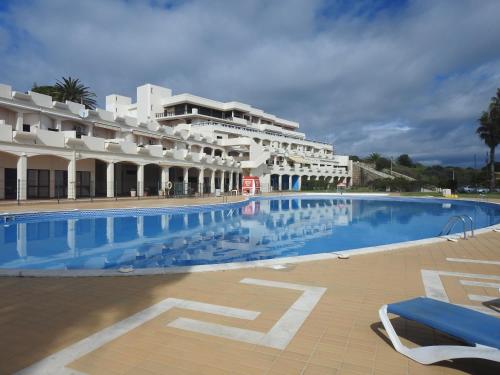 a large swimming pool in front of a building at Lagos Love Bay - sea view in Lagos