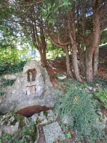 a stone oven in a forest with trees at Hotel Mirabeau in Bellagio
