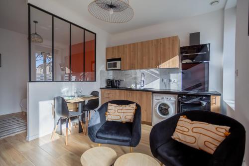 a kitchen with a table and chairs and a dining room at Chez Yvette 1 Ground floor Near the sea in Leucate