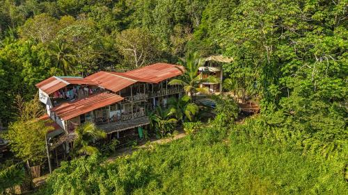 an aerial view of a house on a hill at Utria hostel in El Valle