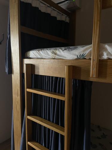 Postel nebo postele na pokoji v ubytování 西嚕小屋