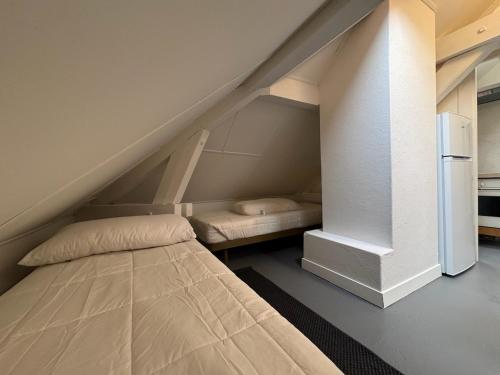 Postel nebo postele na pokoji v ubytování Charming 3P en attique Genève Veyrier Salève