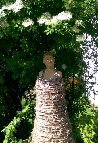 a man is sitting in a tree at Villa Romantica Mit Tollem Blick Auf Den Bodensee in Sipplingen