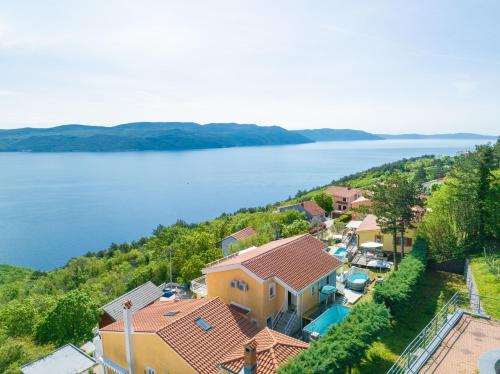 an aerial view of a house next to a lake at Sara in Zagorje