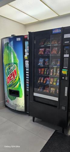 a vending machine with a bottle of beer in it at Quality Inn & Suites Manhattan in Manhattan