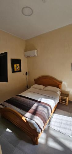 a bedroom with a large bed in a room at Ryad 91 in Casablanca