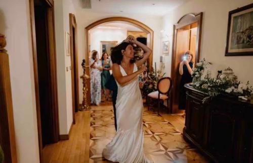 a woman in a wedding dress standing in a hallway at Charming & Luxury Villa Como Lake in Como