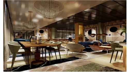 a living room with a table and chairs at Hotel Indigo Lima Miraflores by IHG in Lima