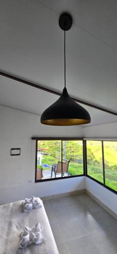 a room with a bed and a large window at Volcano Panoramic Views in Vara Blanca