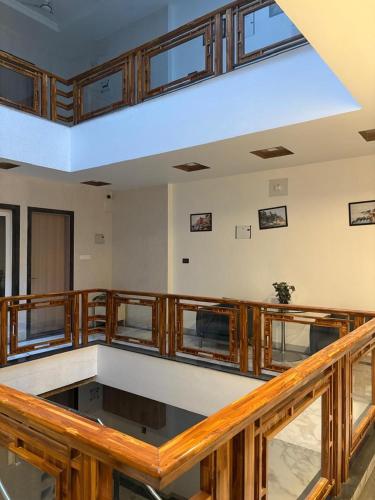 an empty room with wooden railing and a blue ceiling at Arti nilayam in Varanasi
