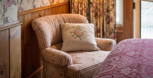 a pillow sitting on a chair in a room at The Chanler at Cliff Walk in Newport
