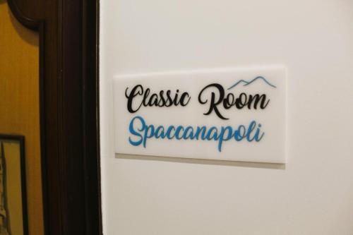 a sign on a door that reads cassius room supermarket at Punto Felice Riviera - Centro Città Lungomare Caracciolo in Naples