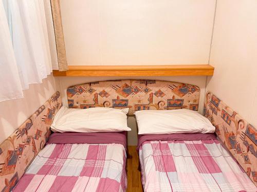 Postel nebo postele na pokoji v ubytování Le sorgenti - Mobile Home 46