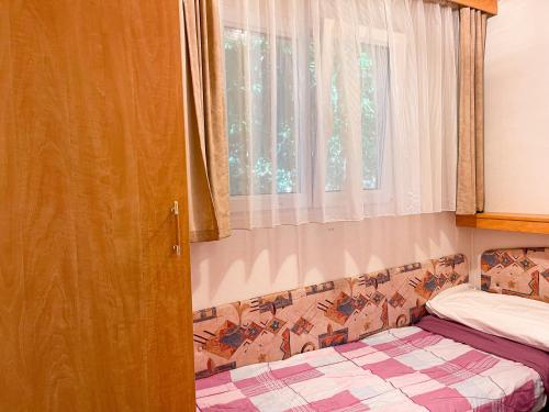 Postel nebo postele na pokoji v ubytování Le sorgenti - Mobile Home 46