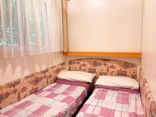 Postel nebo postele na pokoji v ubytování Le sorgenti - Mobile Home 46