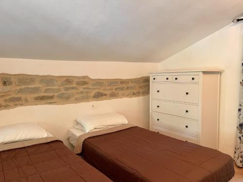 Postel nebo postele na pokoji v ubytování Le sorgenti - Bungalow in sasso