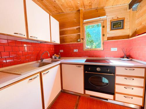 Η κουζίνα ή μικρή κουζίνα στο Le sorgenti - Chalet 12