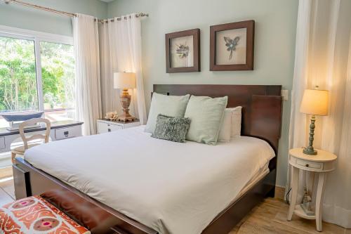 a bedroom with a large bed and a window at Xeliter Balcones del Atlantico - Las Terrenas in Las Terrenas