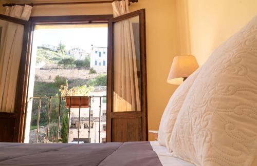 Ένα ή περισσότερα κρεβάτια σε δωμάτιο στο Hostal Posada Huecar