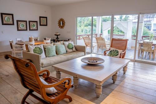 a living room with a couch and a coffee table at Xeliter Balcones del Atlantico - Las Terrenas in Las Terrenas