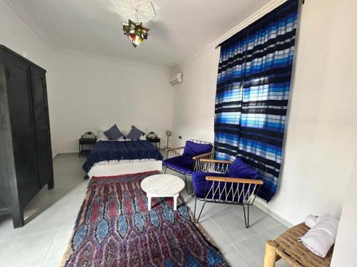 Postel nebo postele na pokoji v ubytování RIAD DAR ESSOURY Marrakech