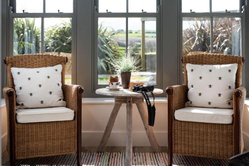 two chairs and a table in front of a window at Number Nine in Lanchester