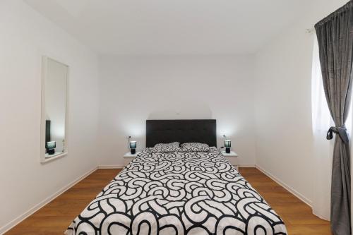 Foto Three-Bedroom Home Dina 2