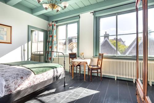 Postel nebo postele na pokoji v ubytování B&B In de Prinsenstraat