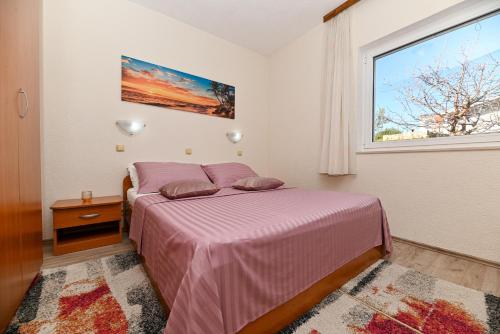 Postel nebo postele na pokoji v ubytování Apartments Patricia