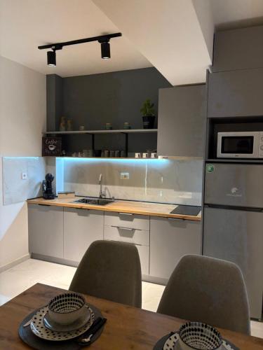 Kuchyň nebo kuchyňský kout v ubytování Apartment N02